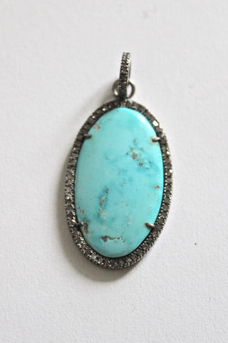 larimar pendant framed by pave diamonds