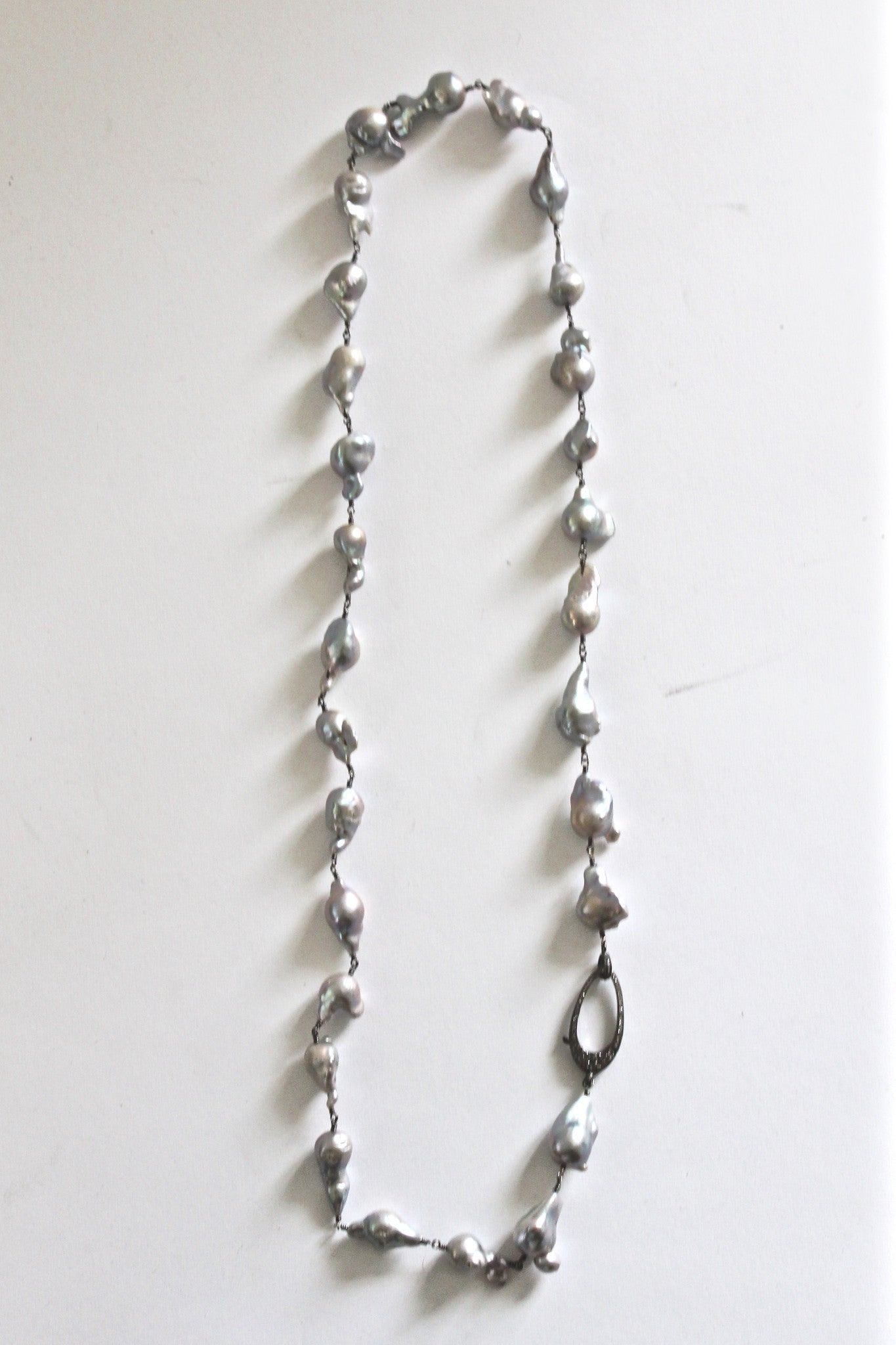 long baroque pearl necklace with pave diamond clasp