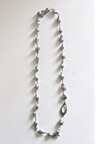 long baroque pearl necklace with pave diamond clasp