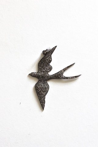 pave diamond-crusted bird pendant