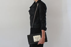 vegetable-tanned leather clutch