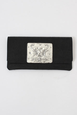 vegetable-tanned leather clutch