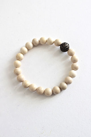 fossilized coral bracelet with small diamond bead