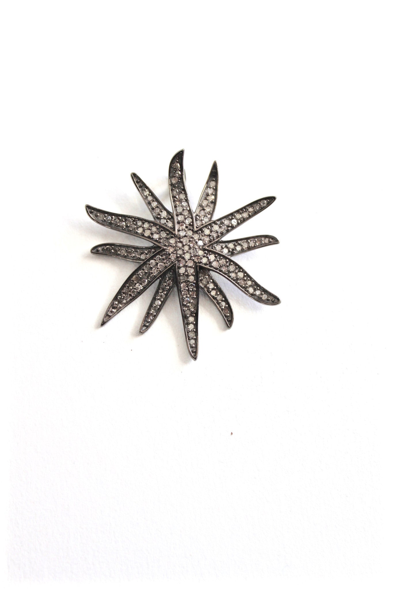 diamond-crusted sunburst pendant