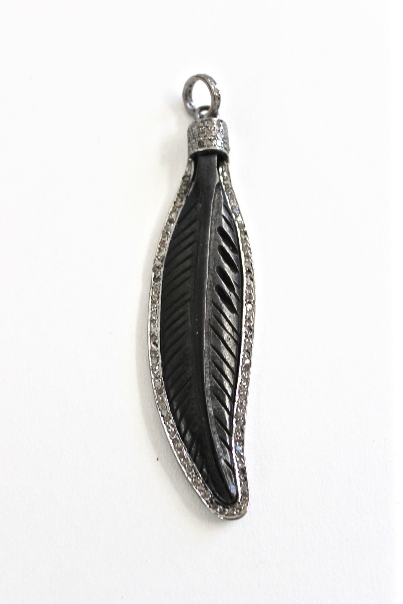 feather yak bone pendant framed with diamond